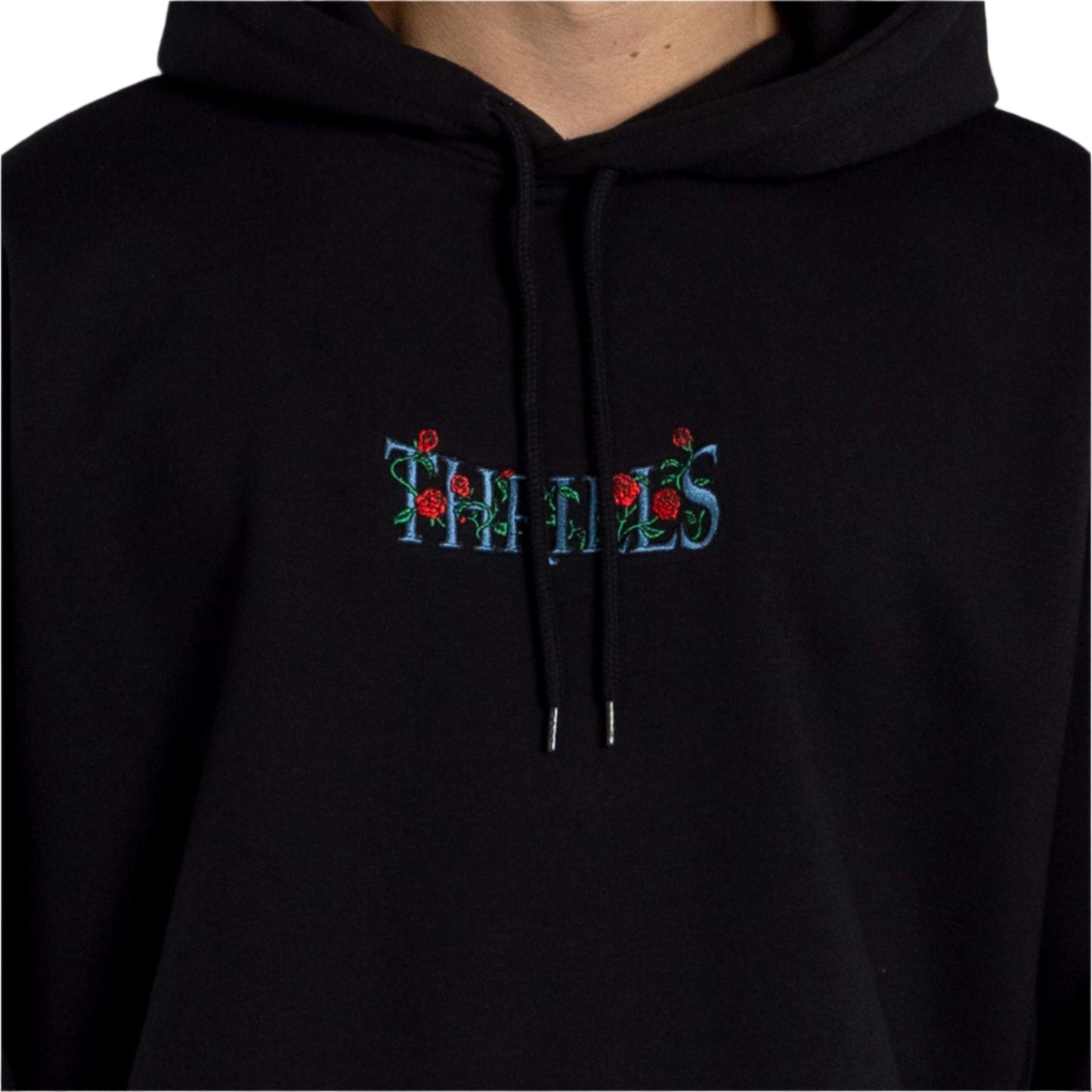 Black hoodie with embroidered text and floral design on a plain background