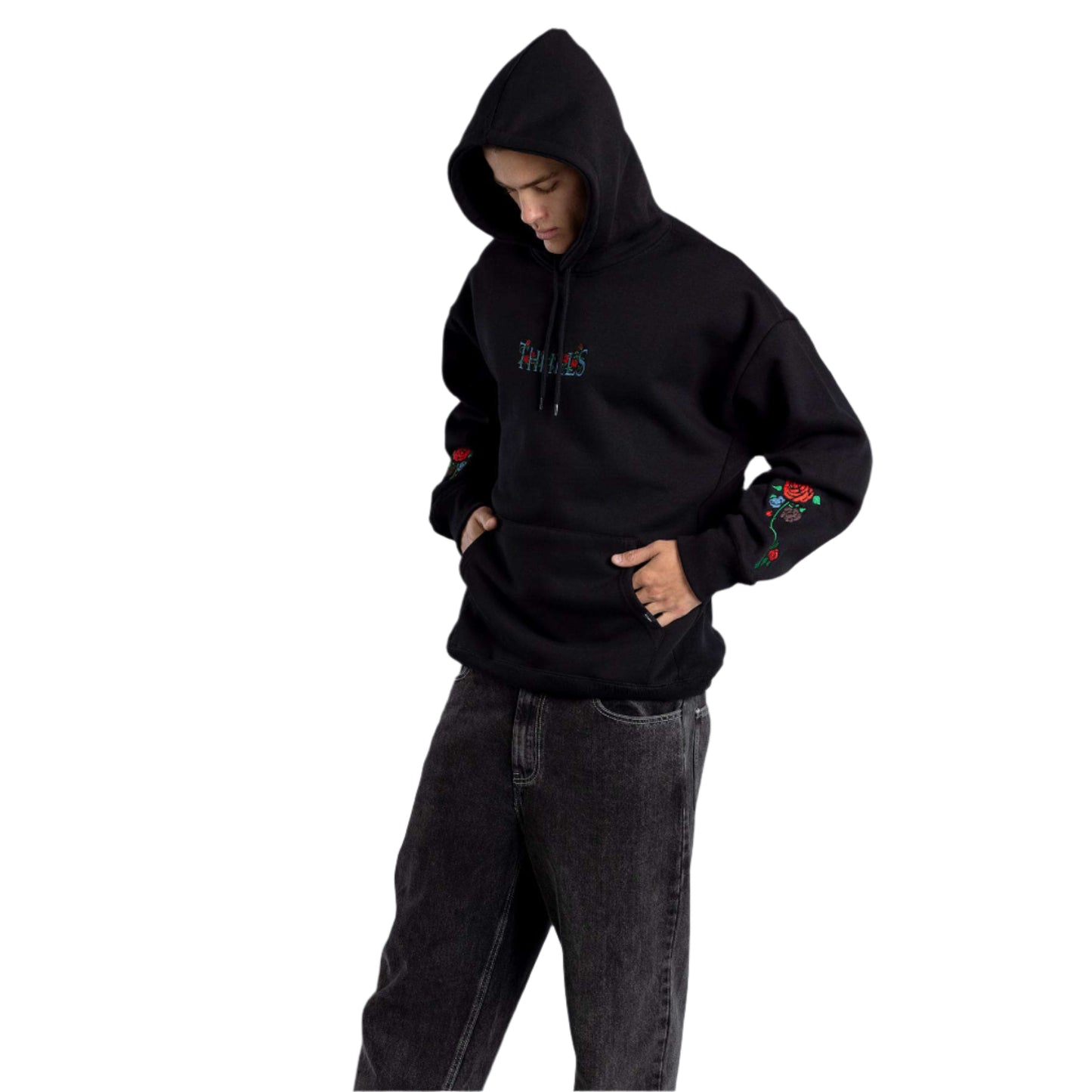 Person wearing a black hoodie and gray pants on a gray background