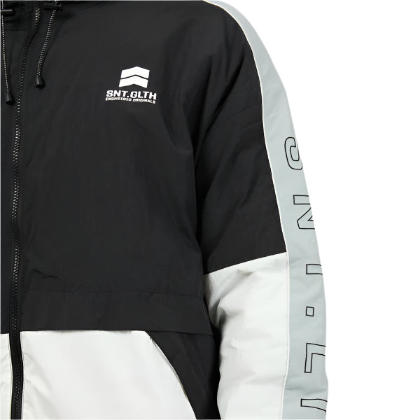 Black and white jacket with branding on a gray background