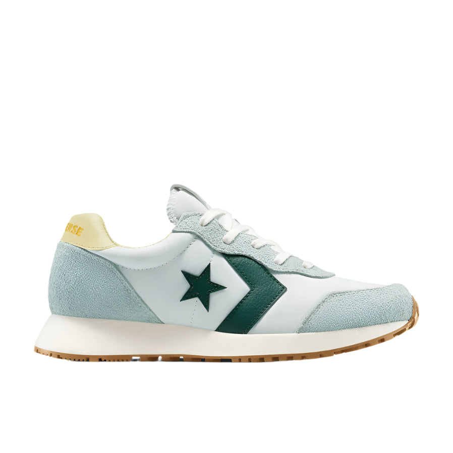 Light blue sneaker with green star and white sole on a white background