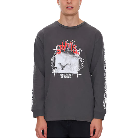 Person wearing a dark gray long-sleeve shirt with graphic design on a light gray background