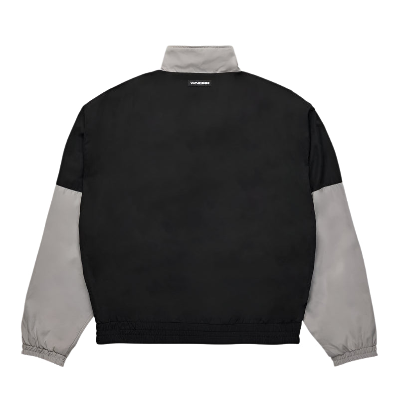 Black and gray jacket with brand logo on the back against a white background